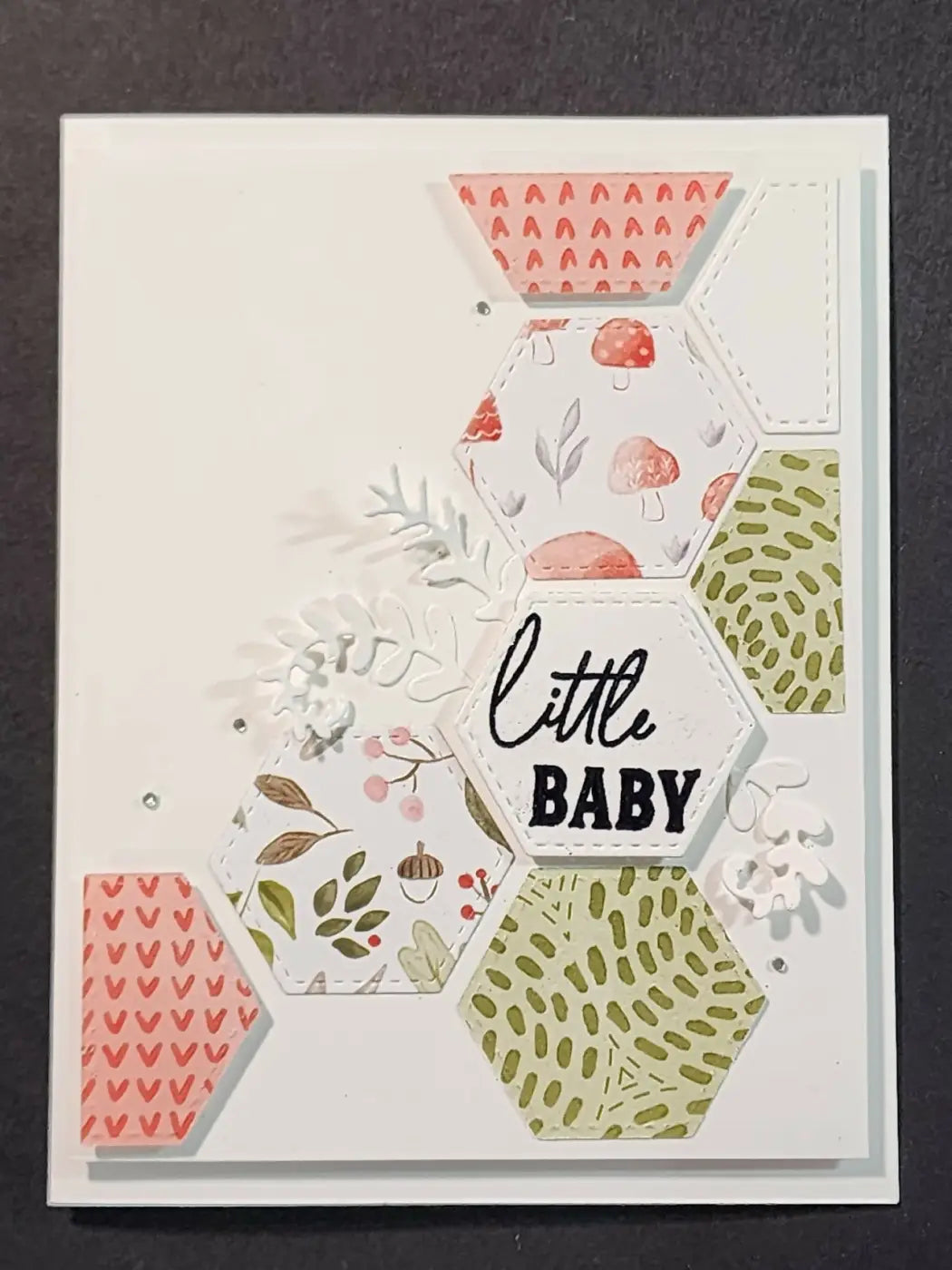 Handmade baby 3 card with a central hexagonal layered design in soft pink green and white patterns for standard cards use