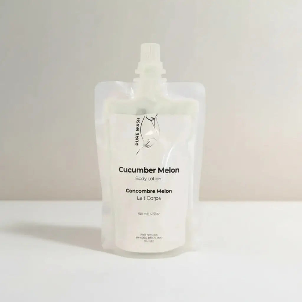 A translucent white shea butter refill pouch of cucumber melon body lotion with minimalist label and kernel oil hand care
