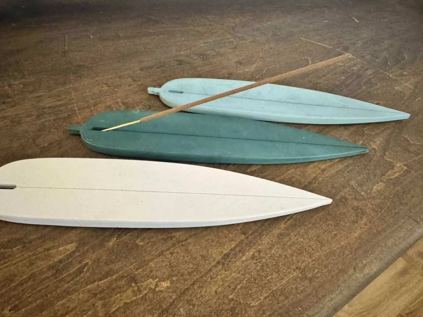 Three handmade resin leaf-shaped incense holders in white teal and light blue for pure wash and incense holder use