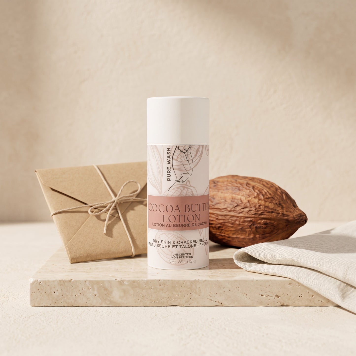 Pure Wash cocoa butter lotion stick for dry skin, featuring a minimalist tube on a stone base with a cacao pod.