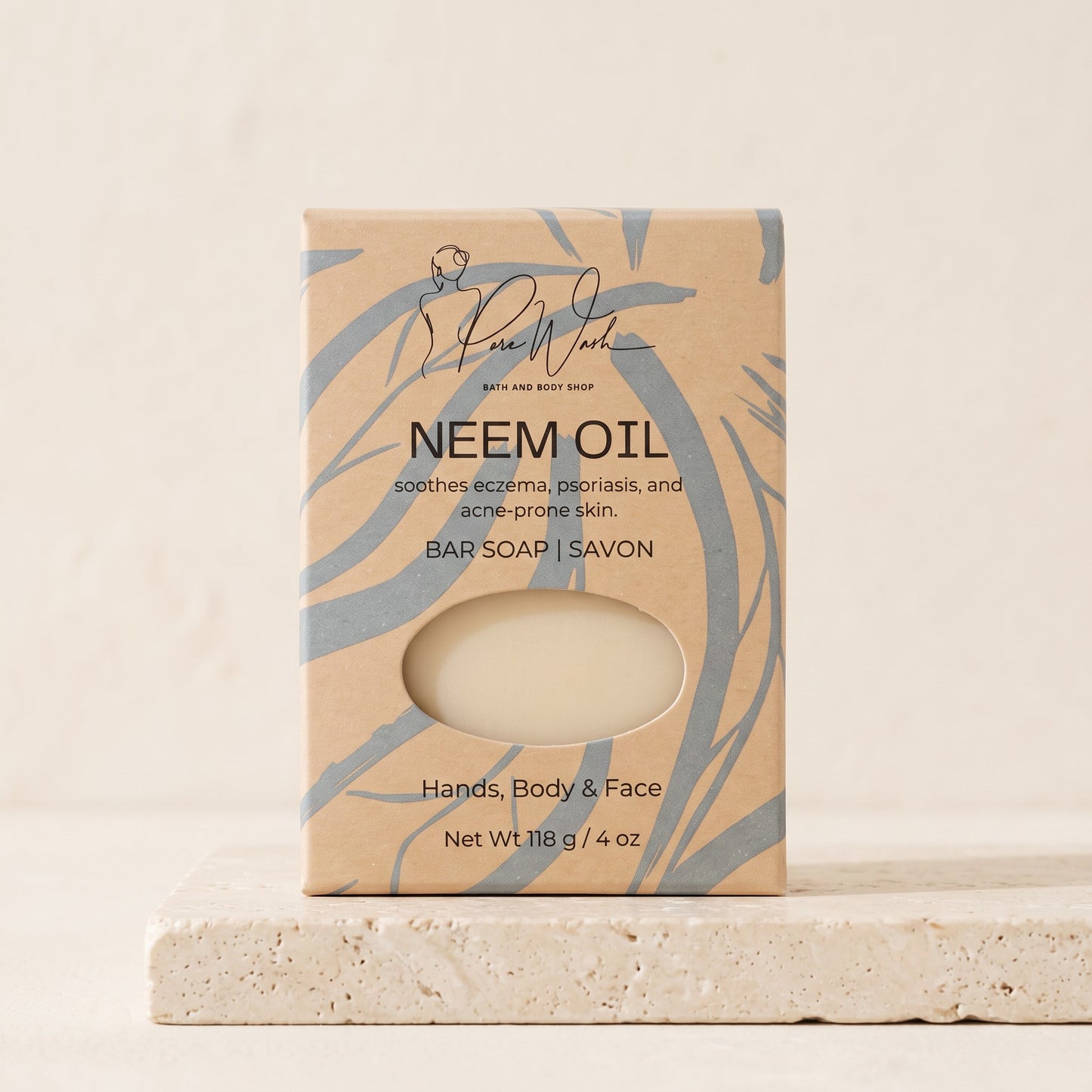 Pure Wash Neem Oil soap bar in eco-friendly kraft paper packaging for sensitive, blemish-prone skin on a stone base.