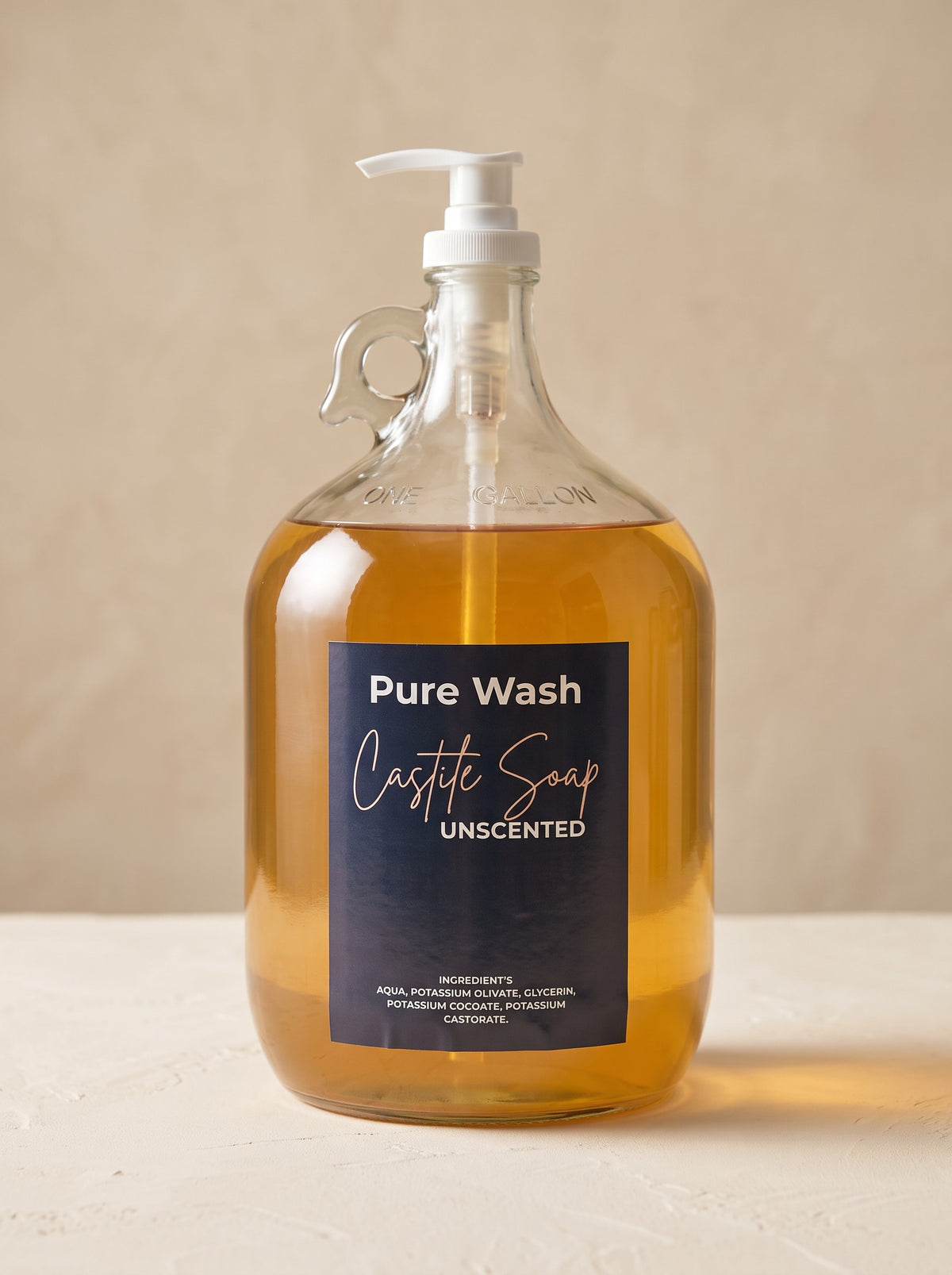 Pure Wash unscented concentrated liquid castile soap in a one-gallon glass jug with a white pump dispenser.