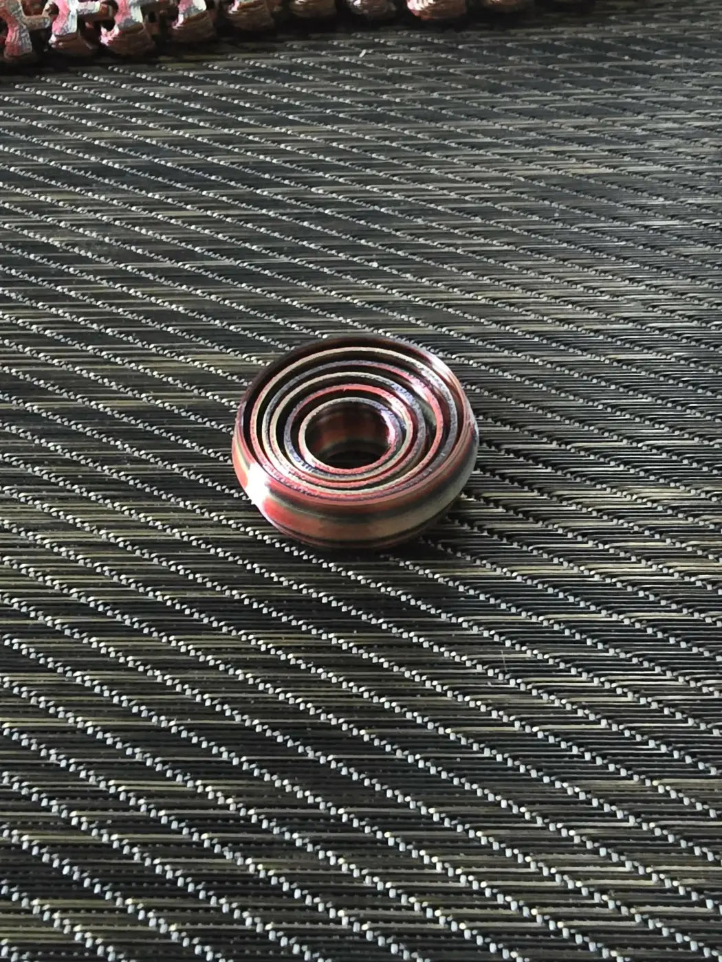 Copper-colored small spinner with multi-layered design and smooth reflective surface ideal as a handmade soap canada accessory