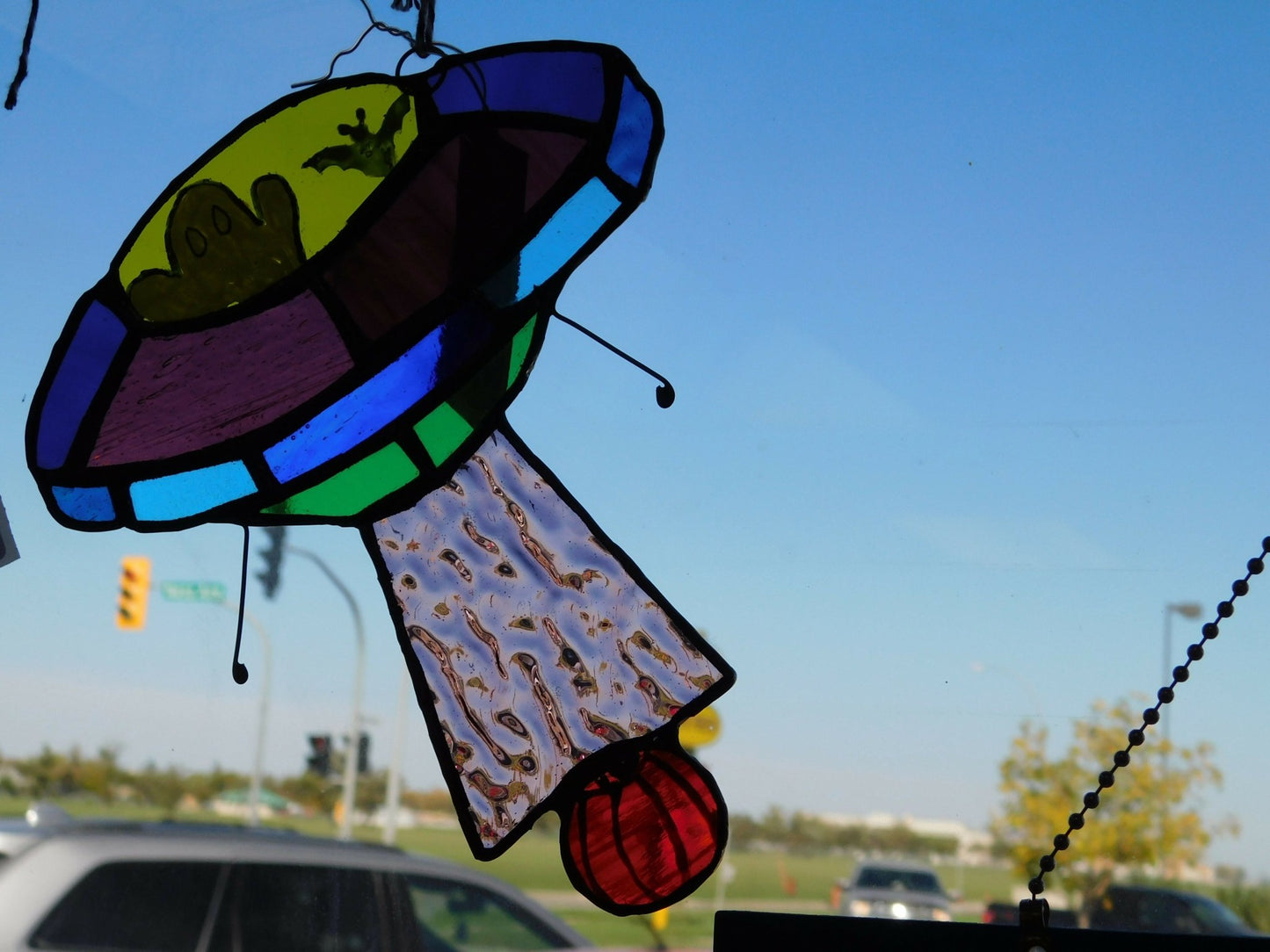 stained glass UFO ship / beaming up pumpkin. Are they out there? approx 6in wide x 7in high , hand painted portions - Pure Wash Canadian Made - Winnipeg
