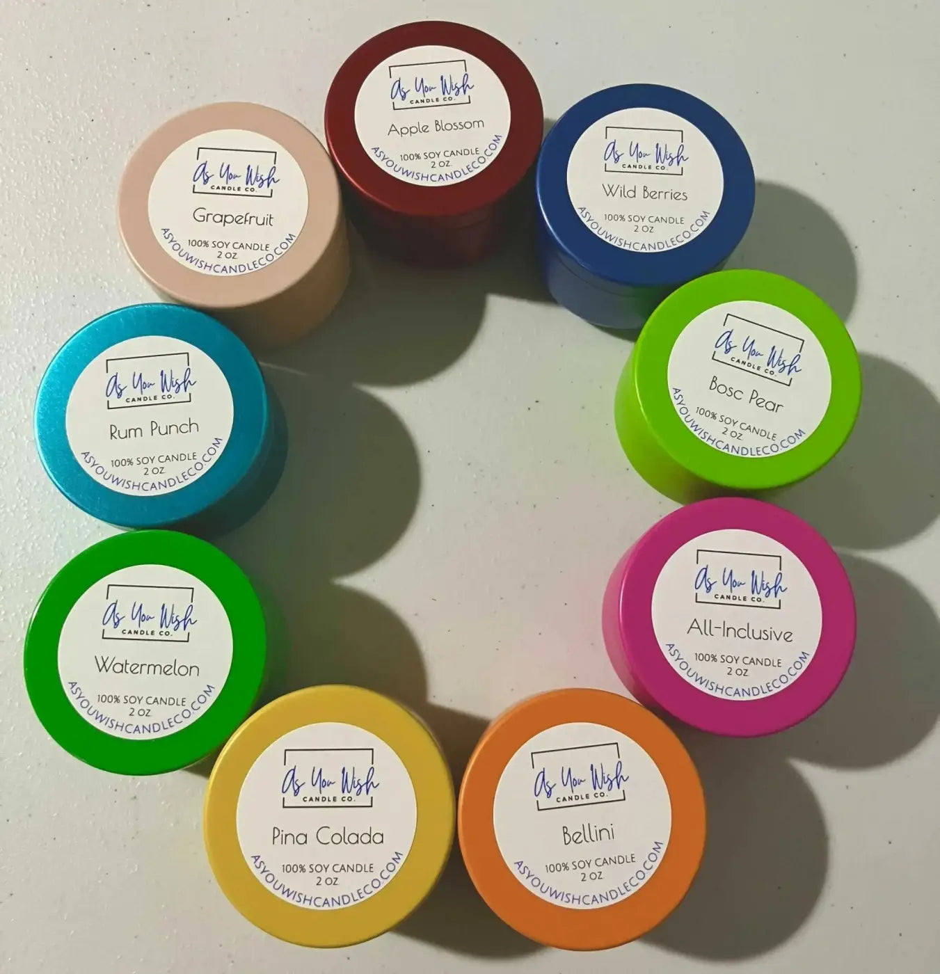 A fruity candle collection of hand-poured 2-ounce soy candles with vibrant lids and juicy scents from as you wish candle co