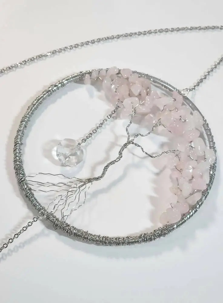 Delicate silver wire-wrapped tree of life necklace with pink rose quartz chips and clear crystal light catcher pendant
