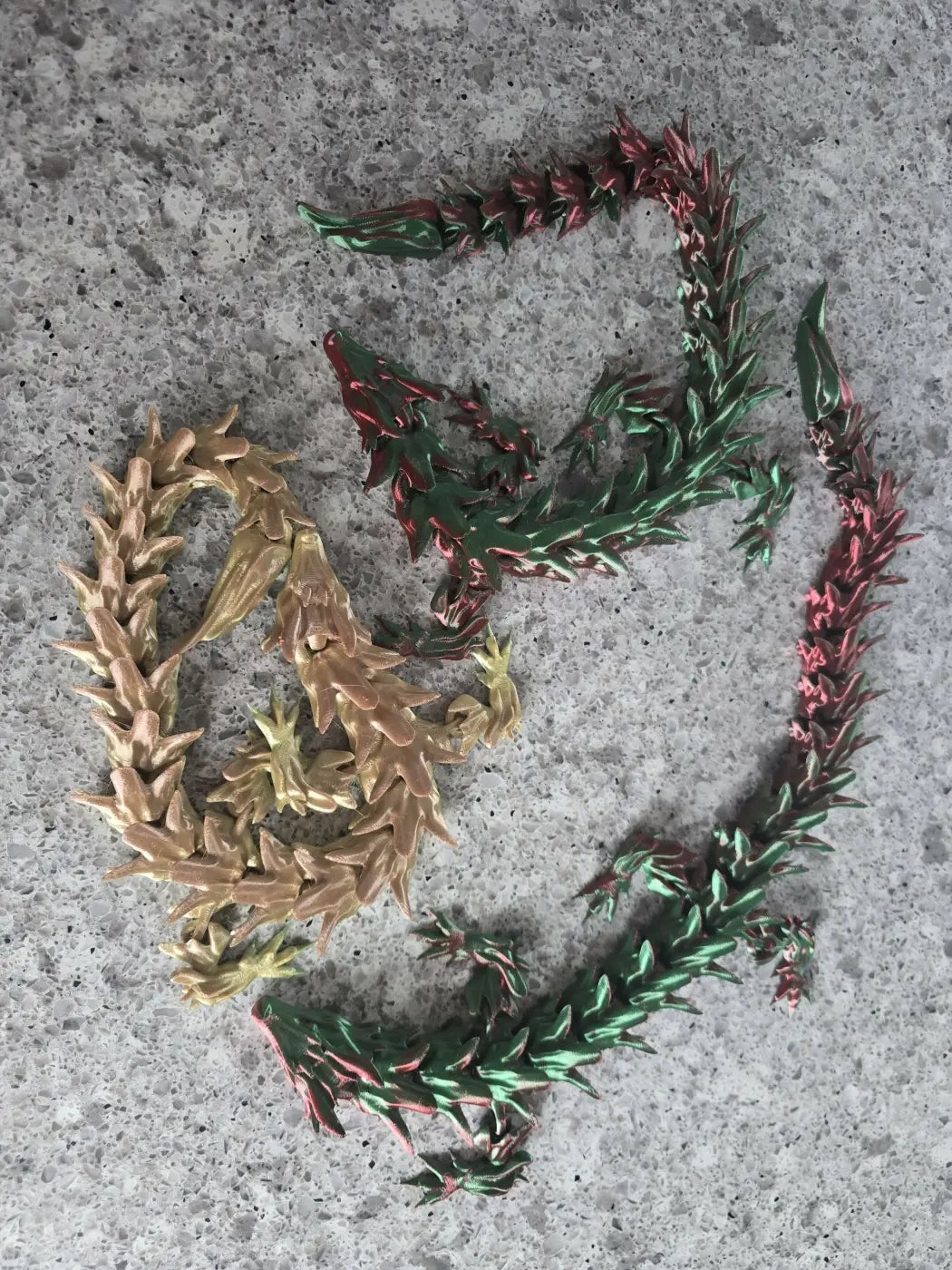 Xl dragon handcrafted gold and green dragon-shaped chains showcasing canadian made skincare inspired design
