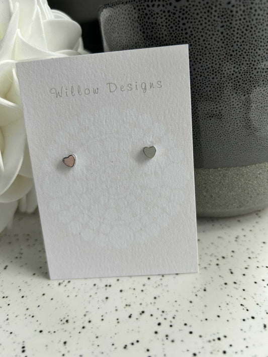 Silver Mini Heart StudsJewelryDainty little heart studs. Perfect for those that love a super dainty earring or for a second piercing. -rhodium plated-hypoallergenic -nickel freeSilver Mini Heart StudsCG Pure Wash