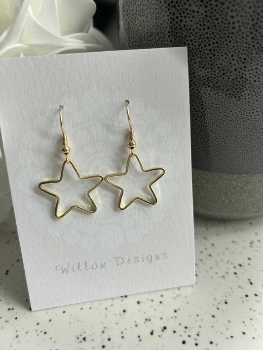 Star Dangly EarringsJewelryPlayful star earrings.-14K gold plated-hypoallergenic -nickel freeStar Dangly EarringsCG Pure Wash