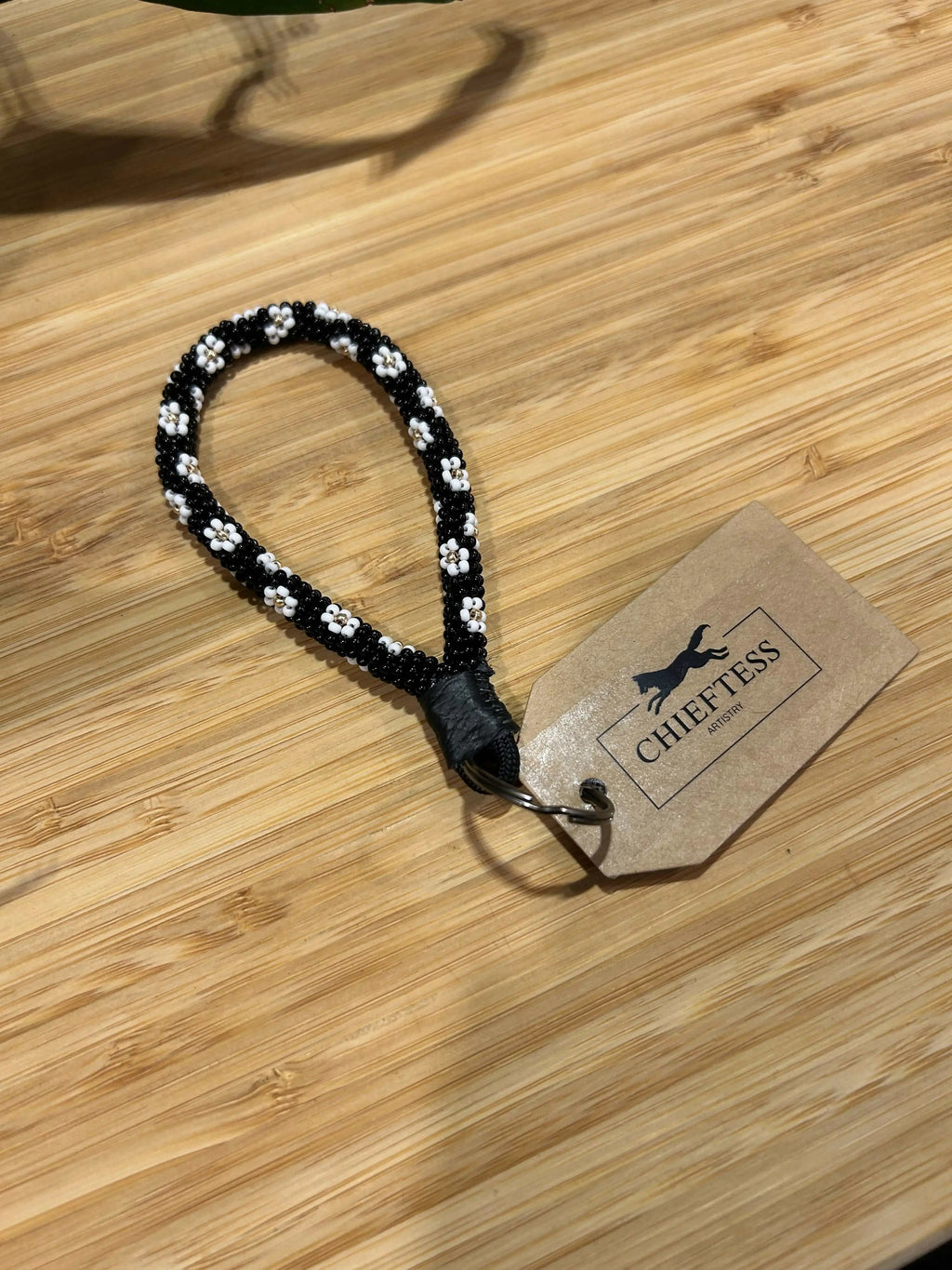 FLORAL Beaded Mini Keychain with bold flower design on white background, genuine leather strap, includes key ring.