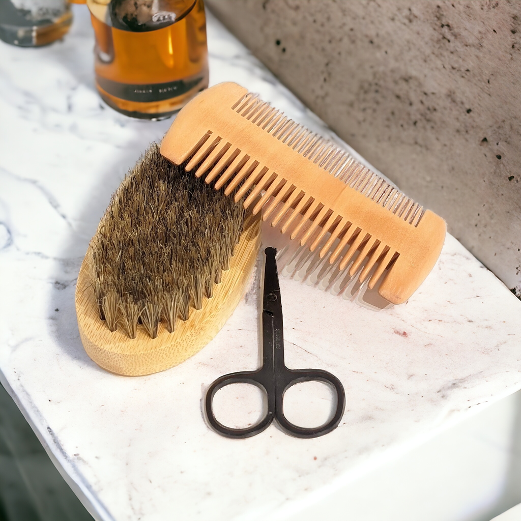 Deluxe Beard Grooming Kit with brush, comb, and scissors on marble surface.