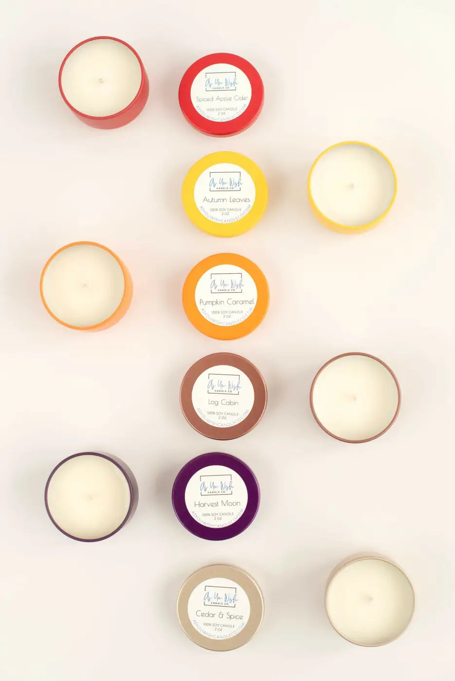 A collection of colorful round mini soy wax candle tins with white wax and pure wash labeled lids ideal as small soy candle gift canada