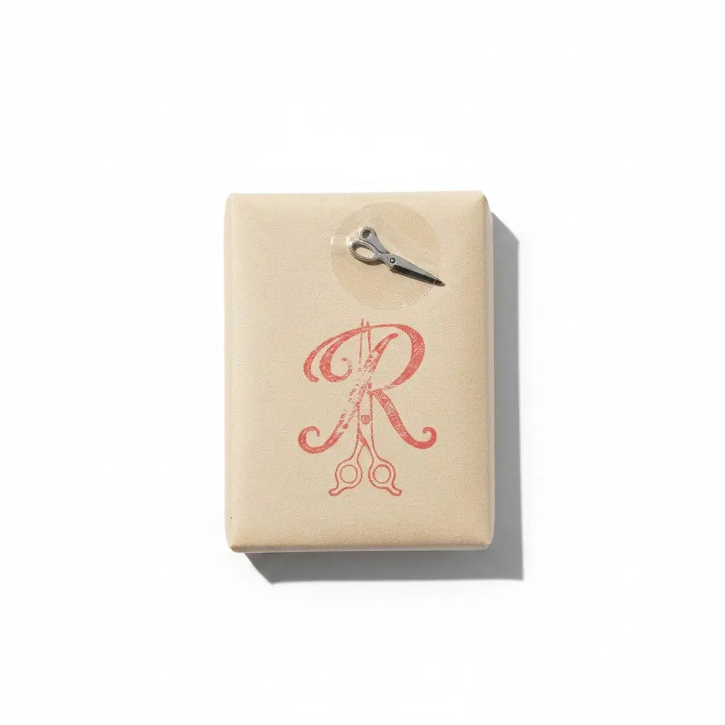 Beige rectangular bar of soap with red r logo and silver scissors for 2nd annual autism awareness fundraiser in memory of rui