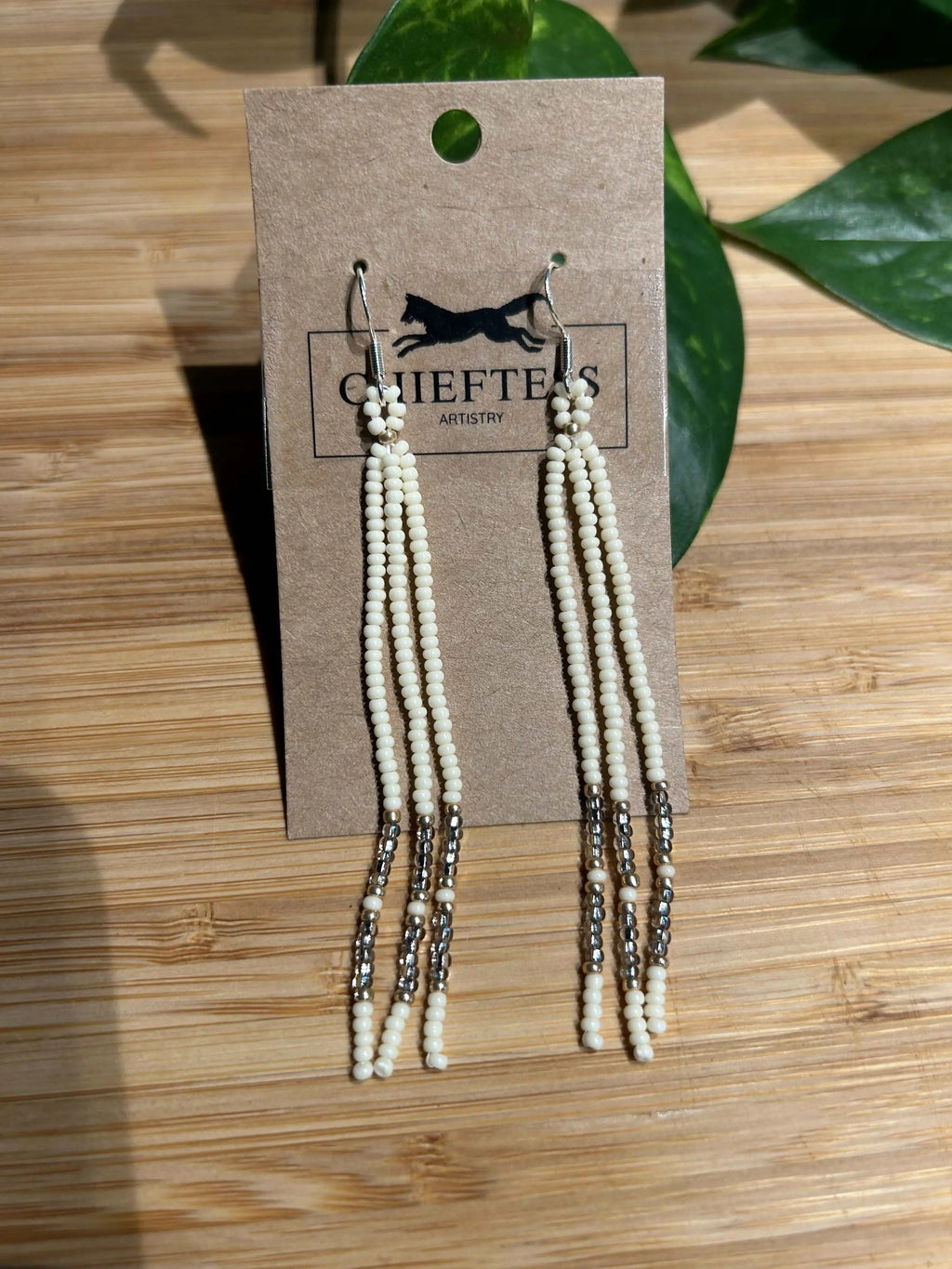 Dangle beaded earrings featuring three delicate strands, approximately 3 inches in length.
