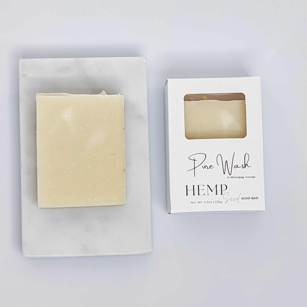 Hemp Seed Soap Bar on a marble tray with packaging, showcasing premium quality hemp seeds for nourishing skin care.