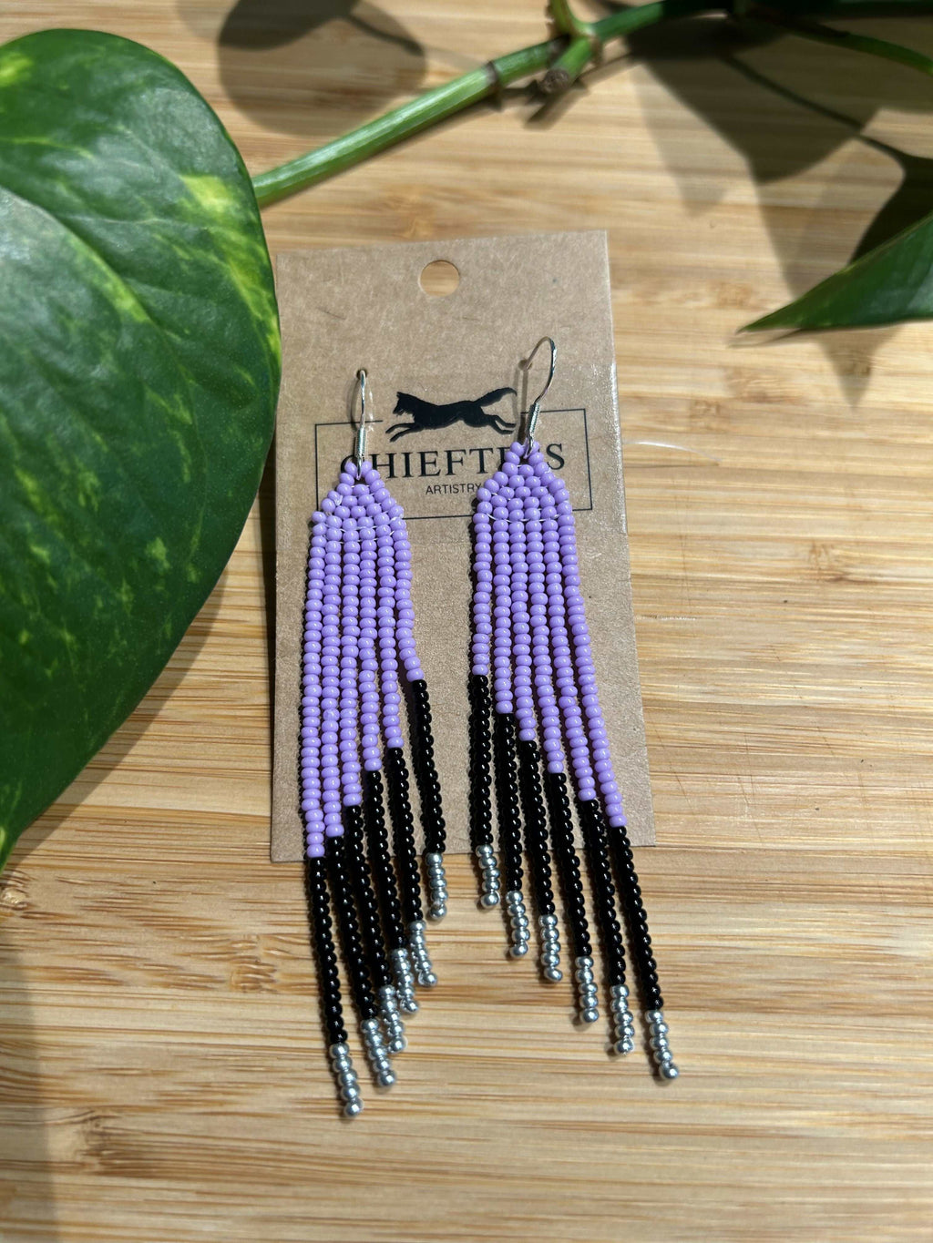 Beaded fringe earrings with six cascading fringes, approximately 3-4 inches long, displayed on a natural background.