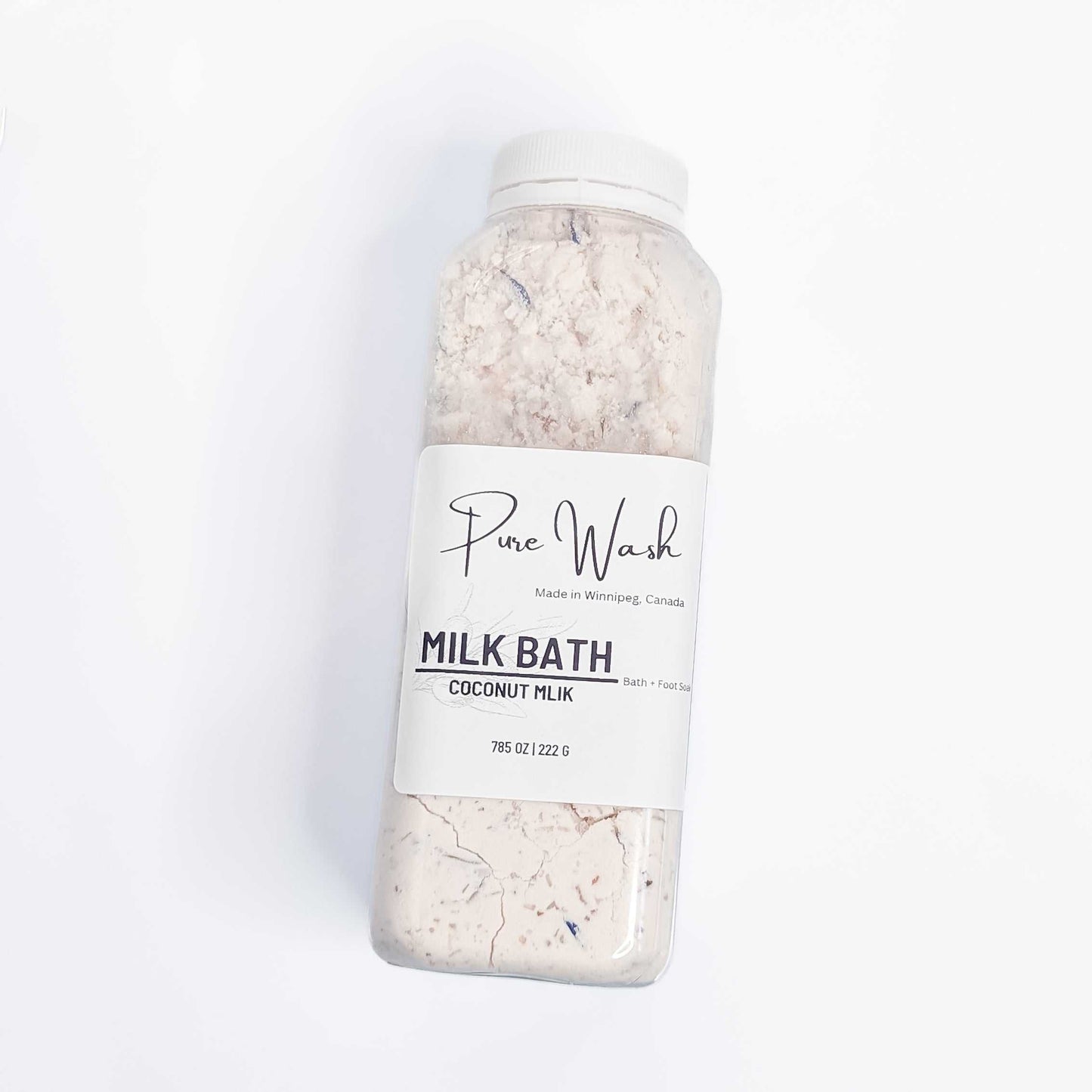 CG Pure Wash Milk Bath Soak bottle filled with coconut milk infused bath powder, presented on a pristine white background, highlighting the natural, handmade quality made in Winnipeg, Canada