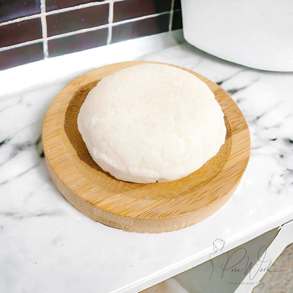 Handcrafted shampoo bar on a bamboo dish, ideal for eco-friendly hair care.