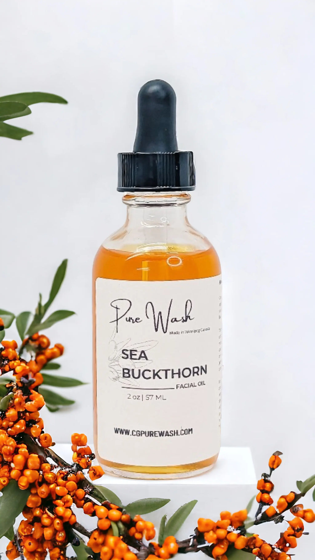 Sea Buckthorn Facial Oil in 30 ml bottle with dropper, rich in omega fatty acids and antioxidants, displayed alongside fresh sea buckthorn berries.