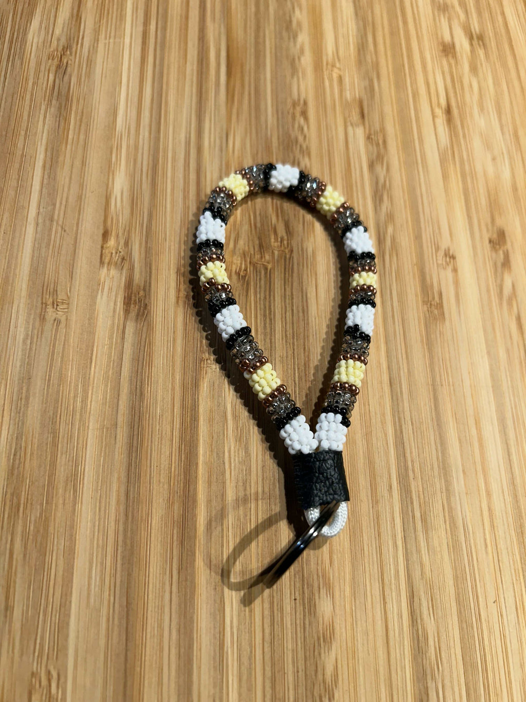 HERA: Beaded Mini Keychain with bold colors, copper accents, and genuine leather, 4-inch length.