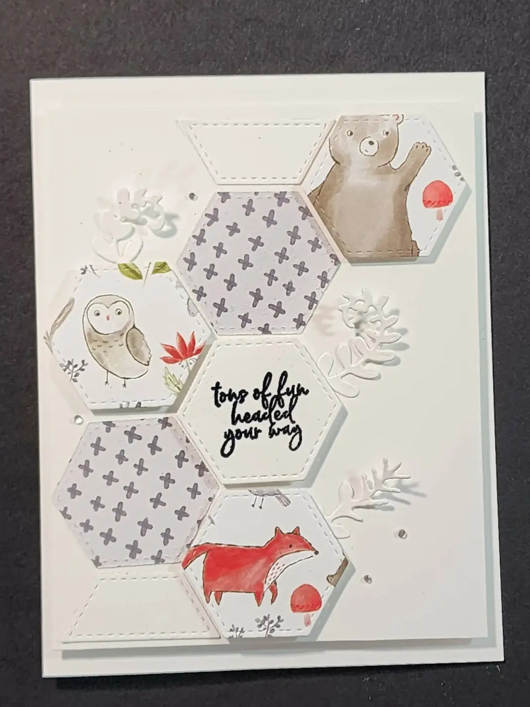 A white hexagonal baby 1 card featuring handmade watercolor illustrations of woodland animals for standard cards use