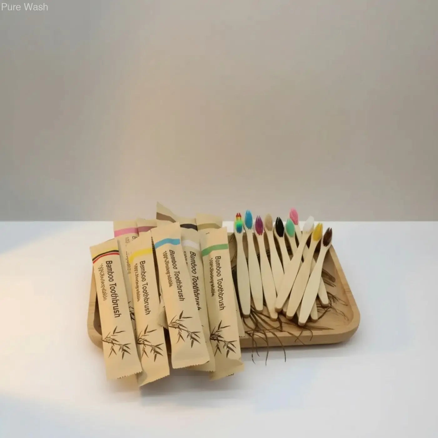 Bamboo biodegradable toothbrushes with colorful bristles and natural wood handles in eco-friendly paper sleeves for reducing plastic waste