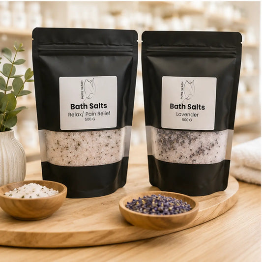 Two black resealable pouches of canadian made skincare bath salts with natural white speckled salt for relaxation and lavender use