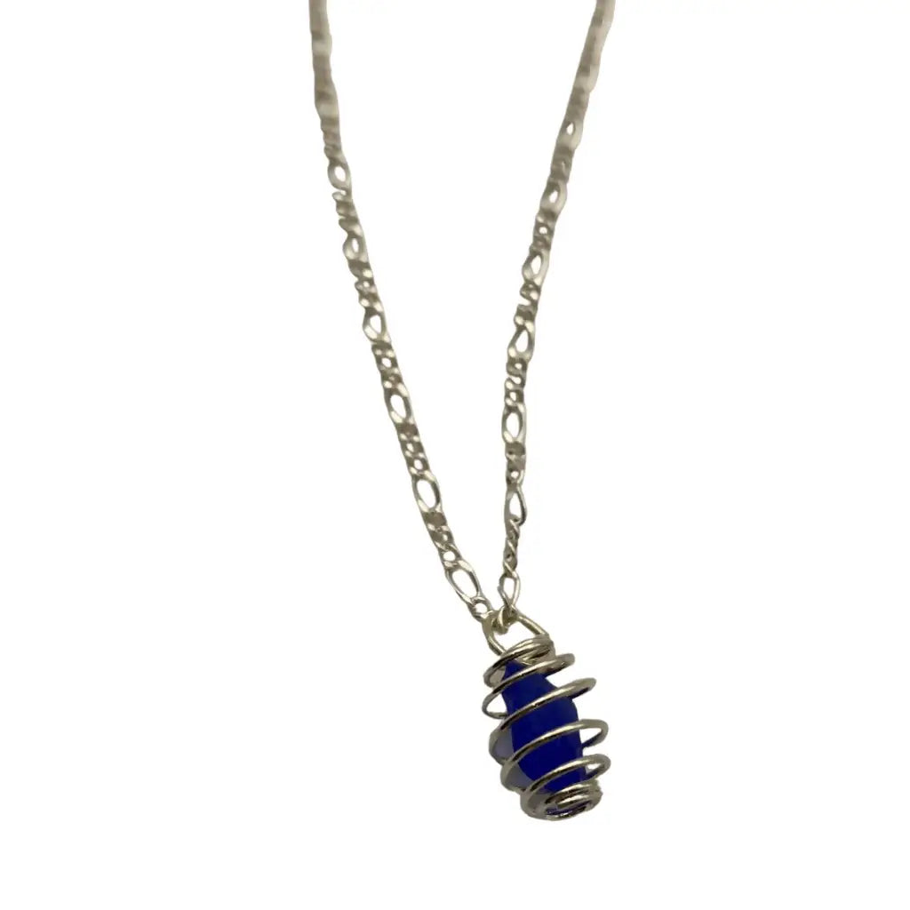 Deep blue beach glass caged pendant with coiled wire wrapping on a silver chain.