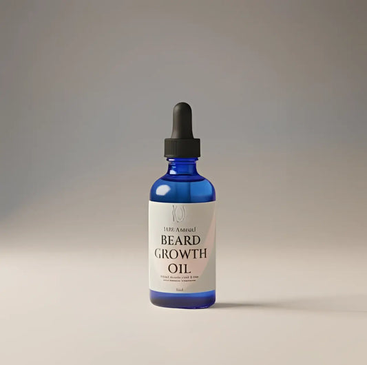 A sleek blue glass bottle of beard oil by ursa adrenal with black dropper cap and minimalist white label for prairie beard growth with seed oil
