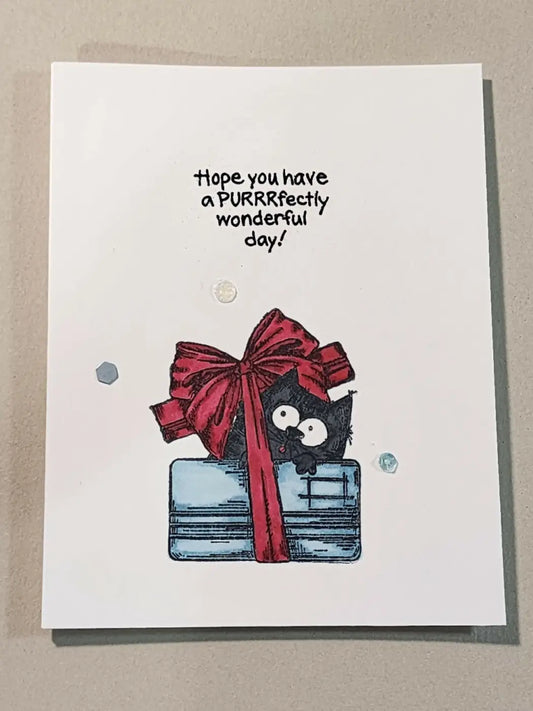 Birthday cat 2 card featuring a black cat peeking from behind a blue gift box with a red bow for simple cards