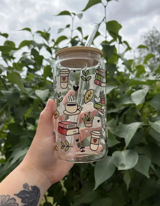 Bookish glass cup featuring clear glass with colorful coffee cup illustrations and a bamboo lid with glass straw