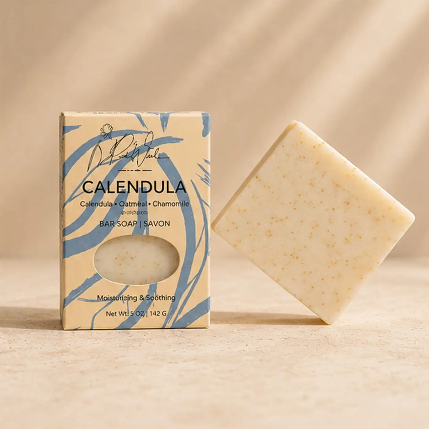 Cream-colored speckled calendula soap bar with square shape supports healthy skin and soothes easily irritated skin