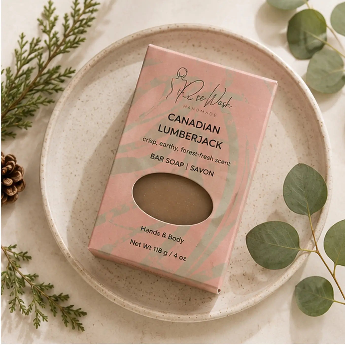 Pink packaged canadian lumberjack soap bar with clear window revealing beige handcrafted skincare for bathing routine
