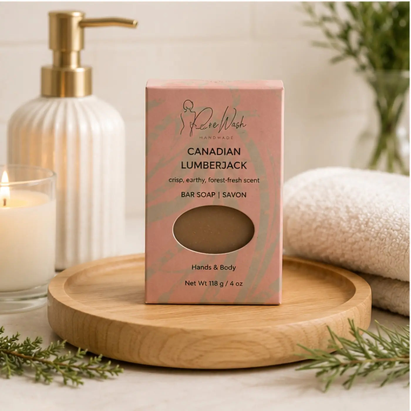 A pink rectangular box of canadian lumberjack handcrafted soap with a natural beige bar visible for bathing routine use