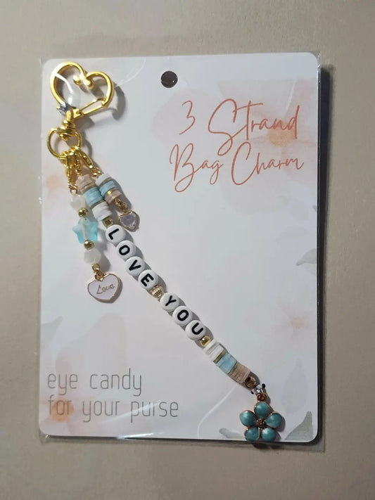 Charm 3 gold-toned keychain with light blue and white beads, heart love charm, and turquoise flower, ideal for handmade soap Canada