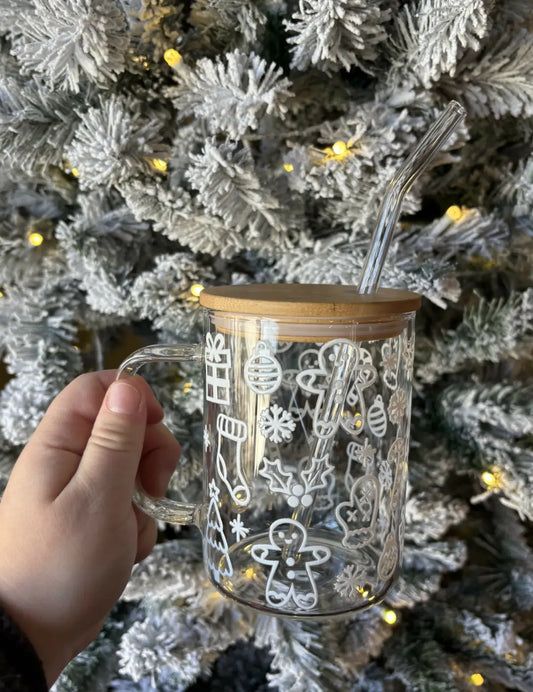 Clear glass Christmas Doodles mug with festive white dtf decals, reusable glass straw, and stylish bamboo lid