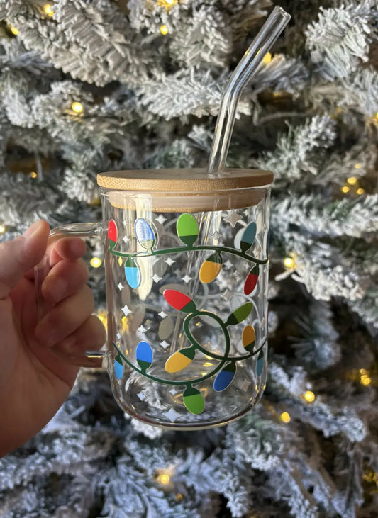 Clear glass christmas light mug with colorful bulbs, stylish bamboo lid, wooden handle, and reusable glass straw
