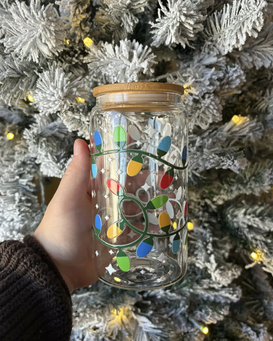 Clear glass jar with colorful christmas lights and a stylish bamboo lid featuring reusable glass straw and dtf decals