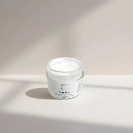 A minimalist white jar of cream it nourishing moisturizer with a clear lid and clean typography for mature skin with shea butter