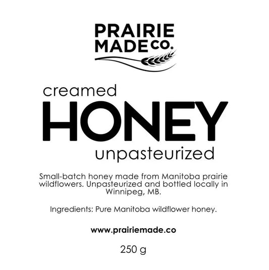 Prairie made co creamed raw honey in a glass jar showcasing naturally delicious unpasteurized raw honey naturally