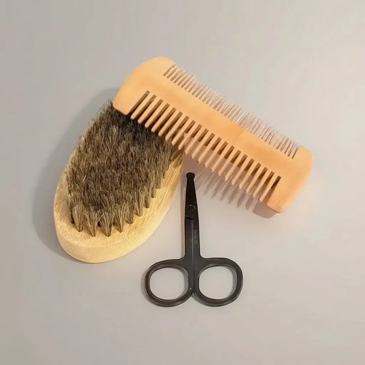 Deluxe beard grooming kit featuring light-colored wooden beard brush with dense natural bristles for precision care
