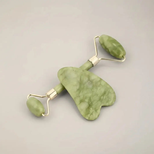 Green jade facial roller and heart-shaped scraper with silver joints for radiance revival face and lymphatic drainage gua sha set