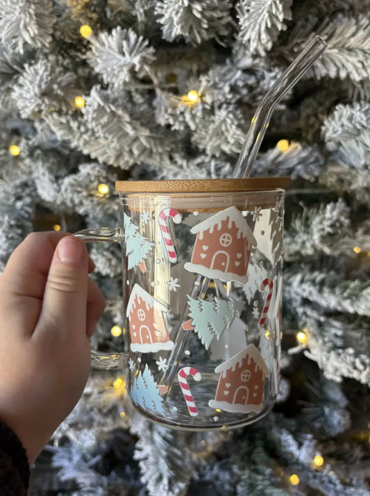 Clear glass gingerbread house mug with stylish bamboo lid and handle, decorated with festive candy cane decals