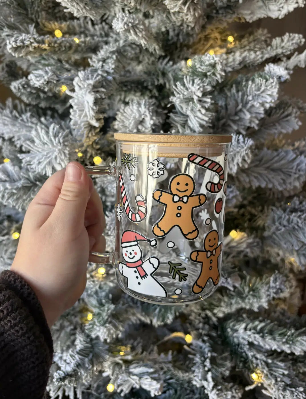 Clear glass gingerbread snowman mug with festive illustrations and bamboo handle and lid microwave safe bamboo mug