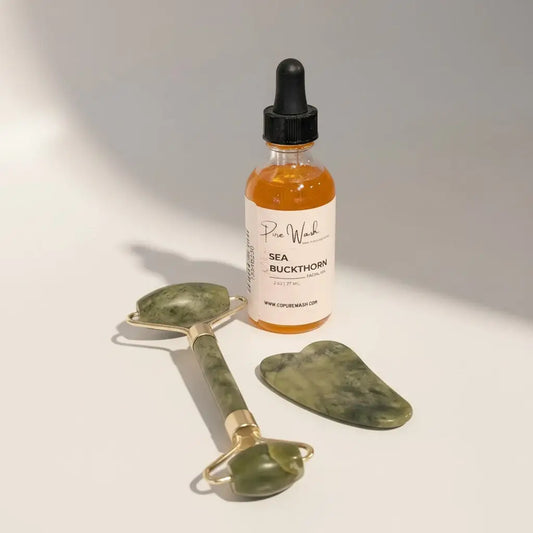 Glow duo jade roller and sea buckthorn facial oil with green jade and gold handle plus amber glass dropper bottle