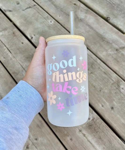 Frosted time glass cup with yellow bamboo lid and clear glass straw featuring pastel good things take time design