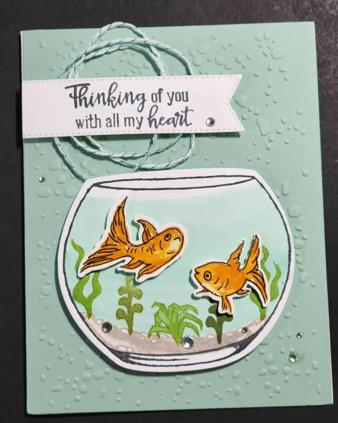 Handcrafted mint green greeting card with circular fishbowl die-cut and goldfish, ideal for canadian made skincare gifts