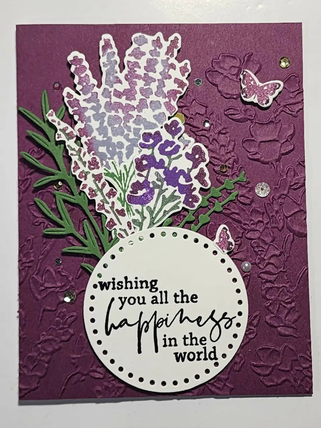 A purple and white floral greeting card with glittery lavender blooms and a wishing you all the happiness label, ideal for canadian made skincare gifts
