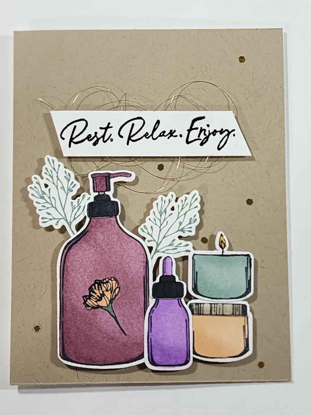 Greeting card featuring a purple pump bottle with black nozzle and pressed flower design promoting canadian made skincare
