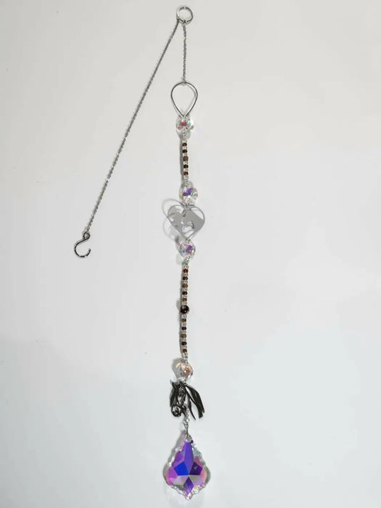 Horse long suncatcher featuring a delicate silver chain with clear and black beads heart charms and an iridescent ornament